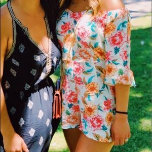 Cream colored off the shoulder floral romper